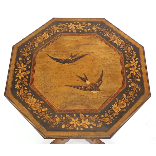 2008 - Olive wood snap top table, the octagonal table inlaid with a central panel of two swallows within a ... 