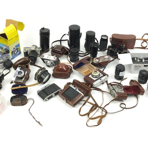 213 - Vintage and later cameras and accessories including Canon, Minolta and Praktica