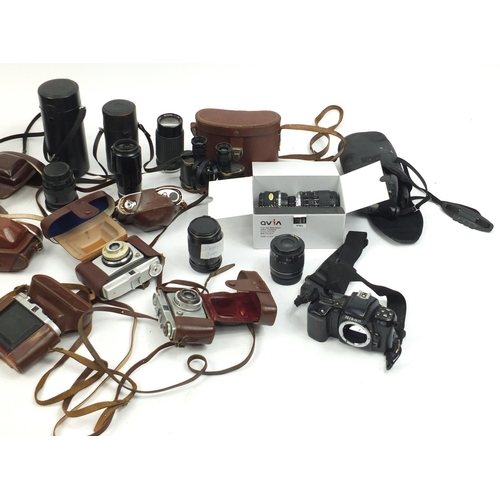 213 - Vintage and later cameras and accessories including Canon, Minolta and Praktica