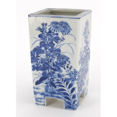 466 - Japanese porcelain blue and white footed vase, decorated with flowers, 20cm high