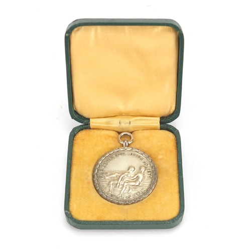 495 - Silver Royal Life Saving Society Award of Merit - J.E Buss 1931, 3.2cm in diameter