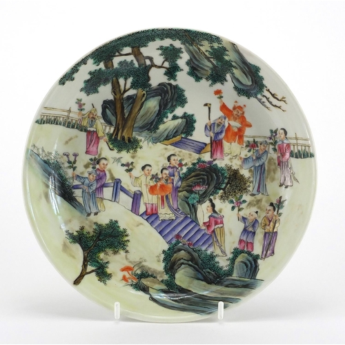 412 - Chinese porcelain dish hand painted in the famille rose palette with figures within a palace setting... 