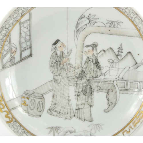 426 - Chinese porcelain tea bowl and saucer, both hand painted with figures in a palace setting, the sauce... 