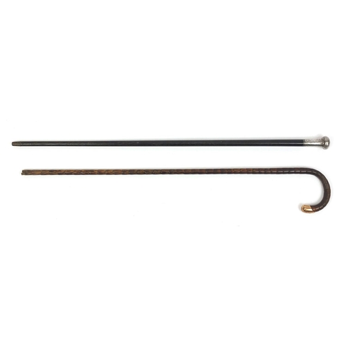 130 - Victorian ebonised walking cane with silver pommel, together with a 15ct gold mounted example, the l... 