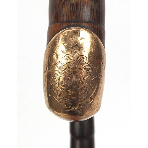 130 - Victorian ebonised walking cane with silver pommel, together with a 15ct gold mounted example, the l... 