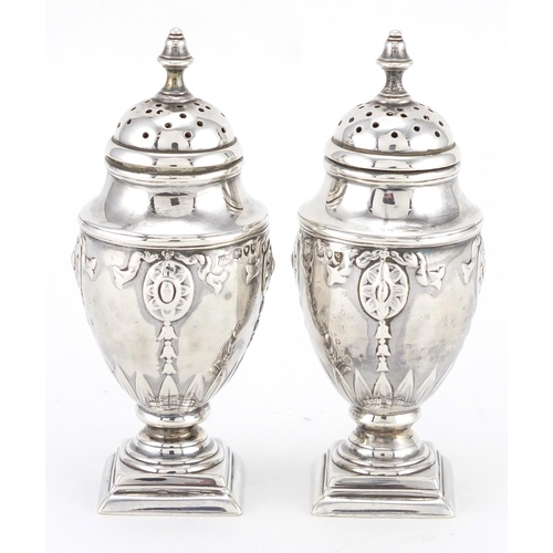 735 - Pair of Victorian silver urn and cover casters, embossed with swags, HW London 1891, 10cm high, appr... 