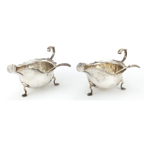 742 - Pair of silver three footed sauce boats with ladles, retailed by Rainforth & Son Newport, Sheffield ... 