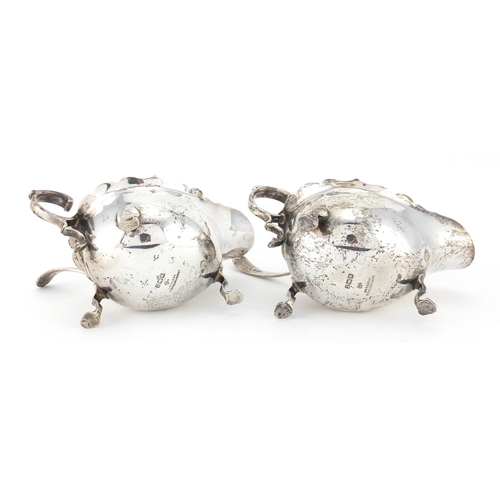 742 - Pair of silver three footed sauce boats with ladles, retailed by Rainforth & Son Newport, Sheffield ... 