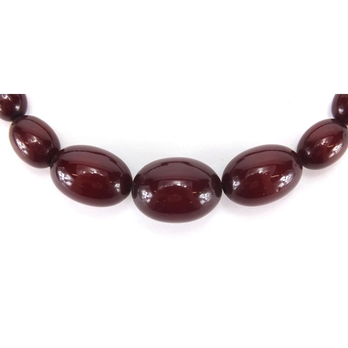 914 - Cherry amber coloured bead necklace, 44cm in length, approximate weight 44.5g