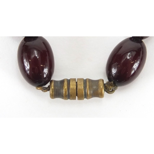 914 - Cherry amber coloured bead necklace, 44cm in length, approximate weight 44.5g