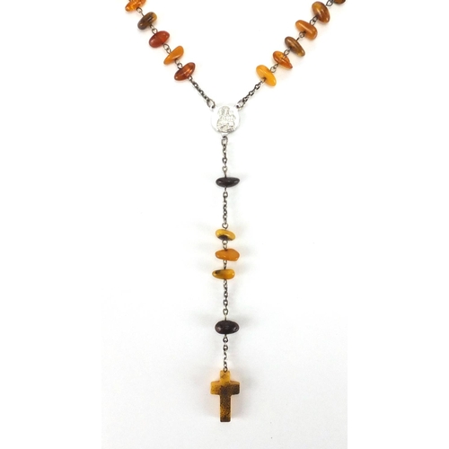 910 - Natural amber rosary bead necklace, 70cm in length, approximate weight 22.6g