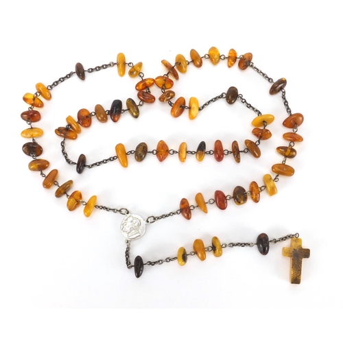 910 - Natural amber rosary bead necklace, 70cm in length, approximate weight 22.6g