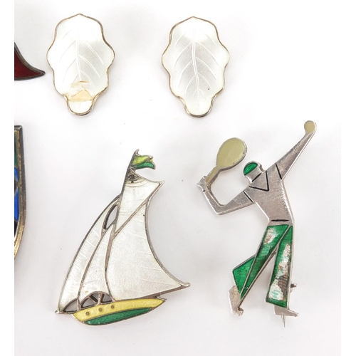 898 - Silver and enamel jewellery including a pair of David Anderson earrings, champagne bottle brooch and... 