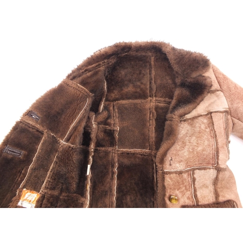 230A - Nurseys sheepskin coat, 80cm in length