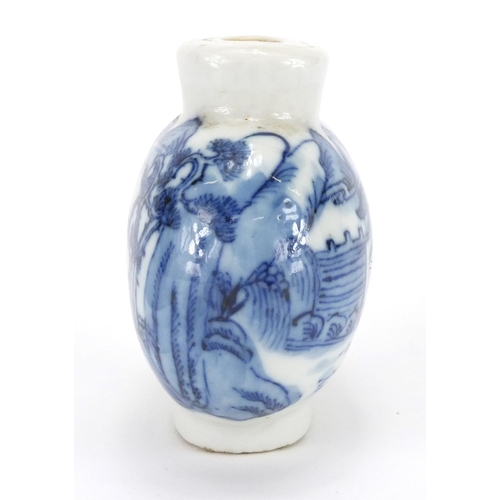 439 - Chinese blue and white porcelain snuff bottle, hand painted with figures crossing a bridge before a ... 