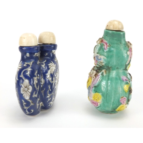 488 - Two Chinese porcelain snuff bottles, one decorated and hand painted in low relief with figures onto ... 