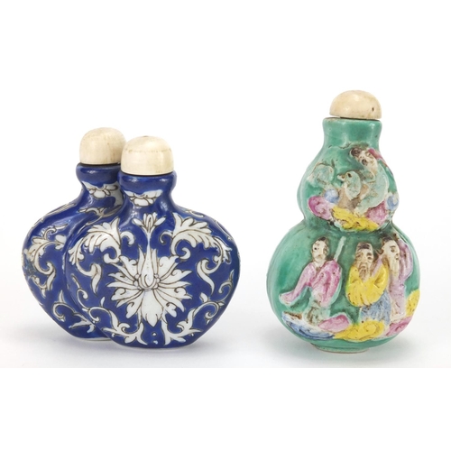 488 - Two Chinese porcelain snuff bottles, one decorated and hand painted in low relief with figures onto ... 