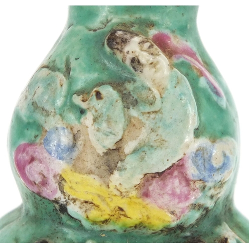 488 - Two Chinese porcelain snuff bottles, one decorated and hand painted in low relief with figures onto ... 