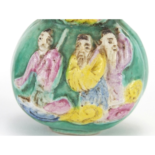 488 - Two Chinese porcelain snuff bottles, one decorated and hand painted in low relief with figures onto ... 