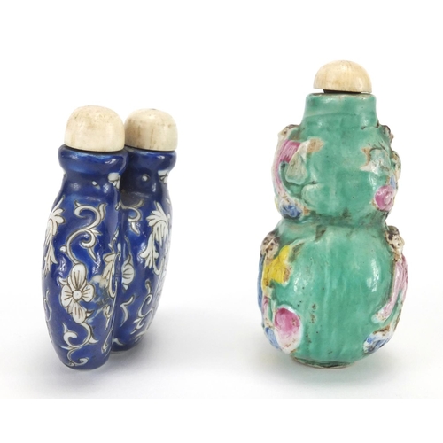 488 - Two Chinese porcelain snuff bottles, one decorated and hand painted in low relief with figures onto ... 