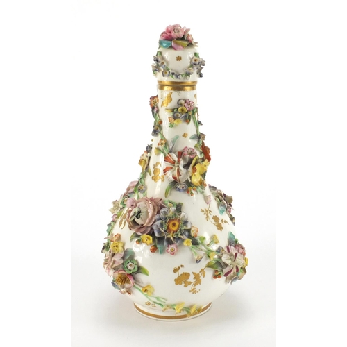 591 - 19th century Sevres floral encrusted porcelain bottle vase and cover, hand painted and gilded with f... 