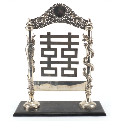 521 - Chinese silver table dinner gong, with dragon and phoenix supports, impressed marks on black slate b... 