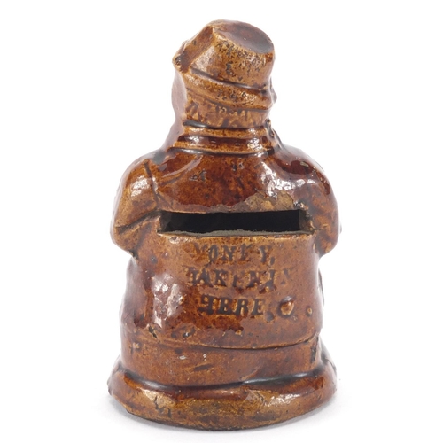 613 - 19th Century treacle glazed pottery money box in the form of a toby jug, impressed 'Money Taken Here... 