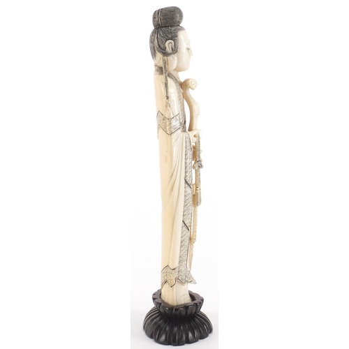 502 - Chinese finely carved ivory okimono of a female wearing a robe on a hardwood stand, 21.5cm high