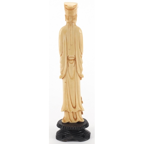 503 - Chinese carved ivory okimono of a gentleman holding a scroll, on hardwood stand, 22cm high