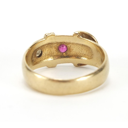 870 - 9ct gold belt buckle ring set with a diamond and ruby, size P, approximate weight 4.6g