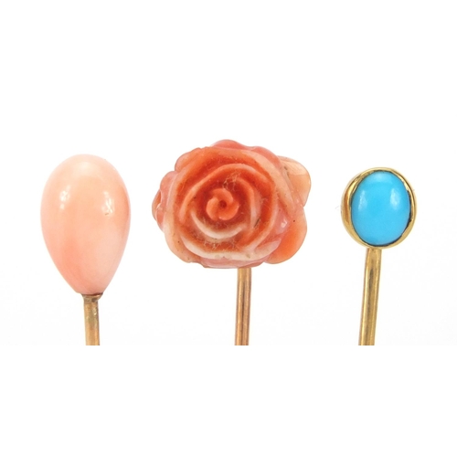 888 - Three unmarked gold tie pins, two with coral and one with cabochon turquoise, approximate weight 3.9... 