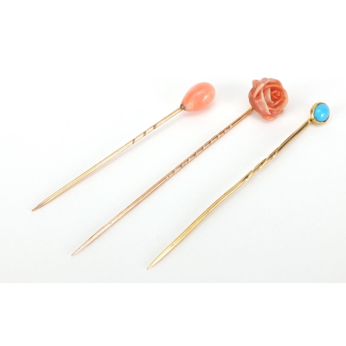 888 - Three unmarked gold tie pins, two with coral and one with cabochon turquoise, approximate weight 3.9... 