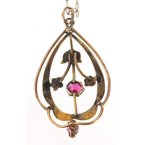 882 - 9ct gold Art Nouveau ruby pendant on a 9ct gold necklace, approximate weight 1.8g