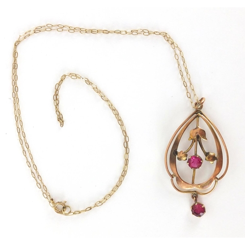 882 - 9ct gold Art Nouveau ruby pendant on a 9ct gold necklace, approximate weight 1.8g