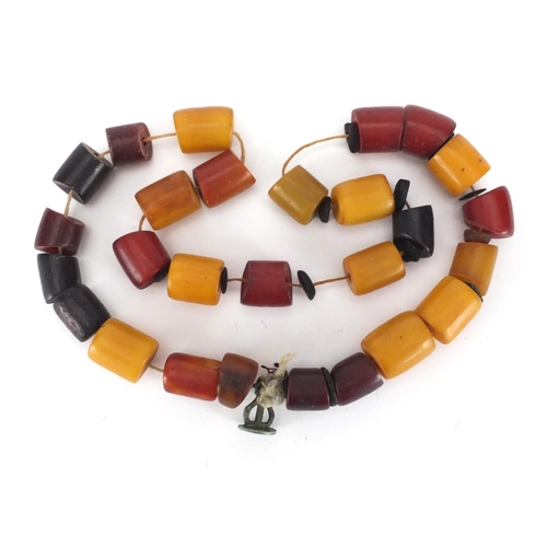 912 - Butterscotch and cherry amber coloured bead necklace, 60cm in length, approximate weight 180.0g