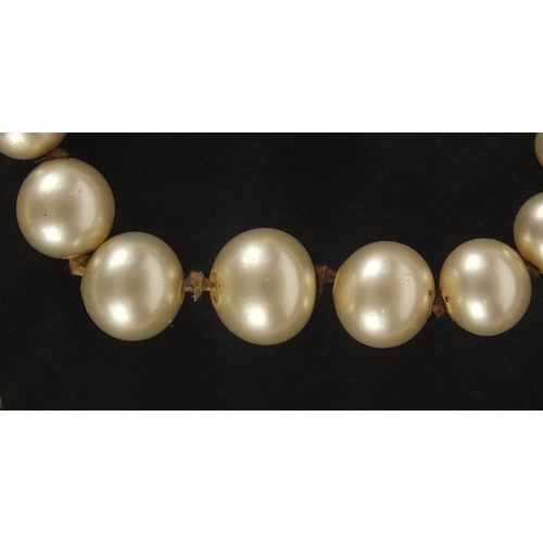 845 - Single string pearl necklace with 9ct gold clasp, 76cm in length, approximate weight 18.4g