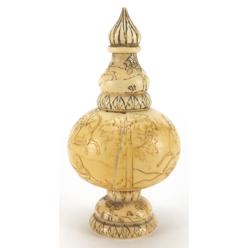 101 - Antique ivory scent bottle engraved with continuous band of figures hunting on horseback, 10cm high