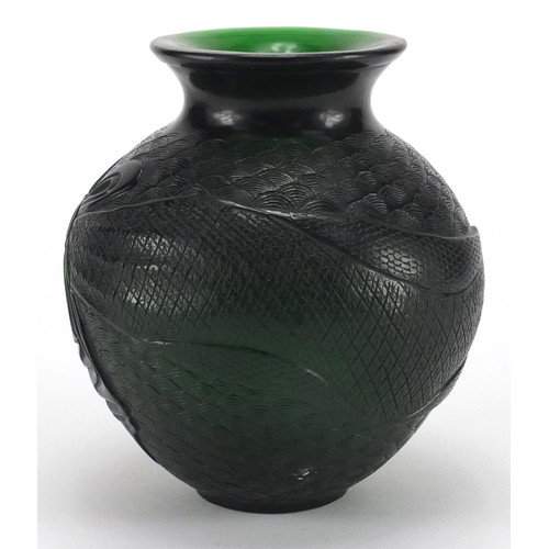 486 - Chinese green Peking glass vase, of ovoid form decorated with crashing waves, 12.5cm high