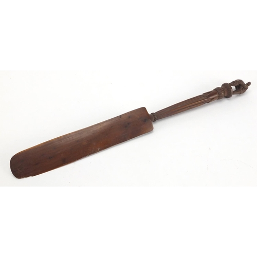 100 - Swiss black forest page turner, the handle carved with two wrestlers, 31.5cm in length