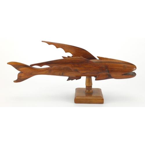 89 - Pitcairn Islands carved wooden flying fish mounted on a wooden stand, 'Greetings from Pitcairn Islan... 