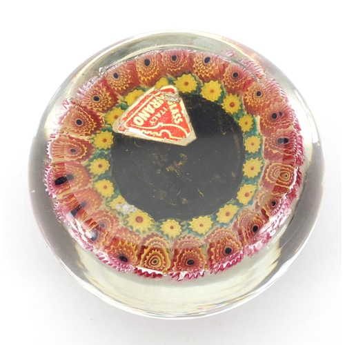 626 - Murano Taurus the Bull glass paperweight with floral borders, red paper label to the base, 9cm in di... 