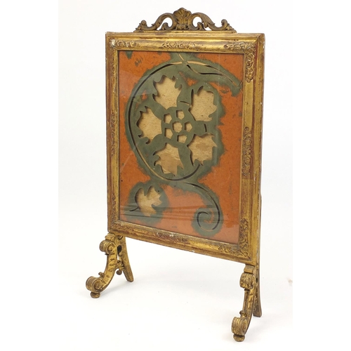10 - Carved gilt wood fire screen with C-scroll feet, 106cm high x 62cm wide