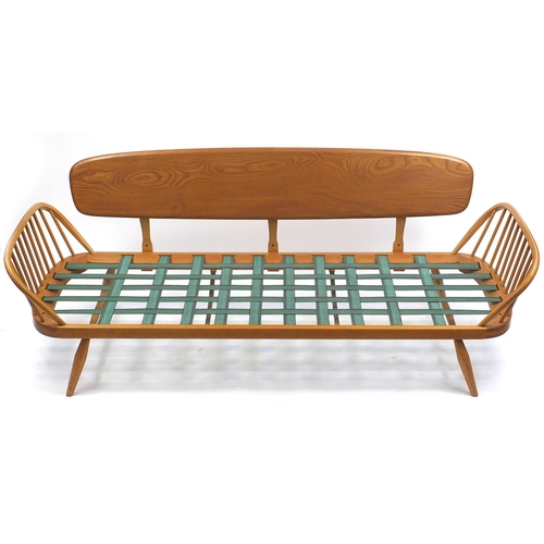 2002 - Ercol light elm Studio day bed, with brown upholstered cushions. 77cm H x 210cm W x 77cm D