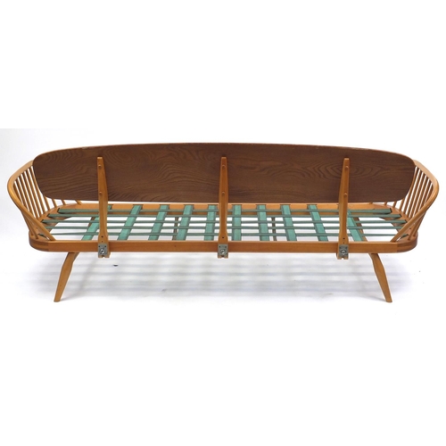 2002 - Ercol light elm Studio day bed, with brown upholstered cushions. 77cm H x 210cm W x 77cm D
