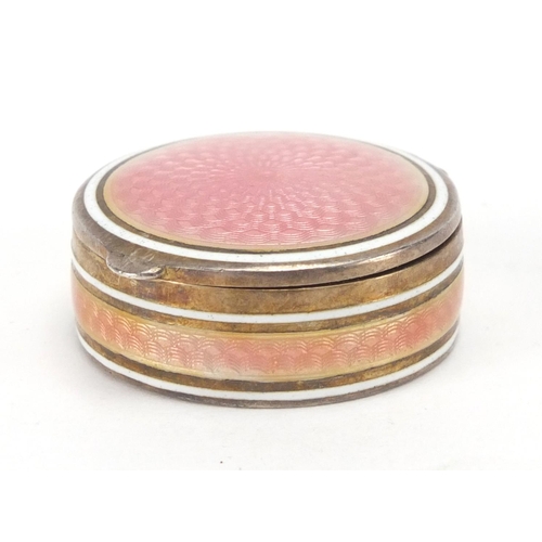 7 - Circular continental 835 silver and pink guilloche enamel pill box, with hinged lid and gilt interio... 