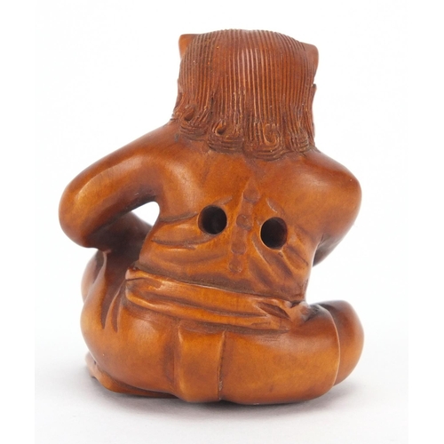 501 - Japanese carved boxwood netsuke of a devil, character marks to the base, 4.3cm high