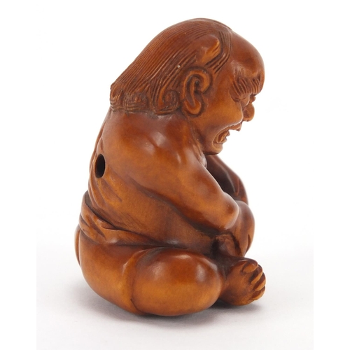 501 - Japanese carved boxwood netsuke of a devil, character marks to the base, 4.3cm high