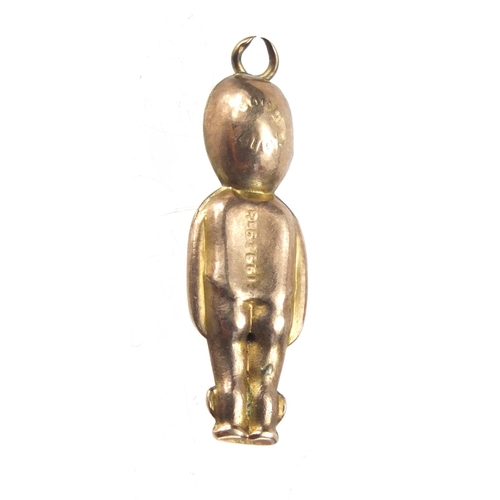 321 - Military interest gold coloured metal Fumsup pendant, 2.8cm in length, approximate weight 1.0g