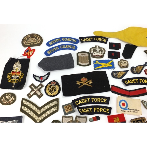 315 - British Military and other cloth insignia and together with a Civil Defence Corps arm band