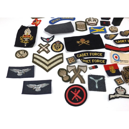 315 - British Military and other cloth insignia and together with a Civil Defence Corps arm band